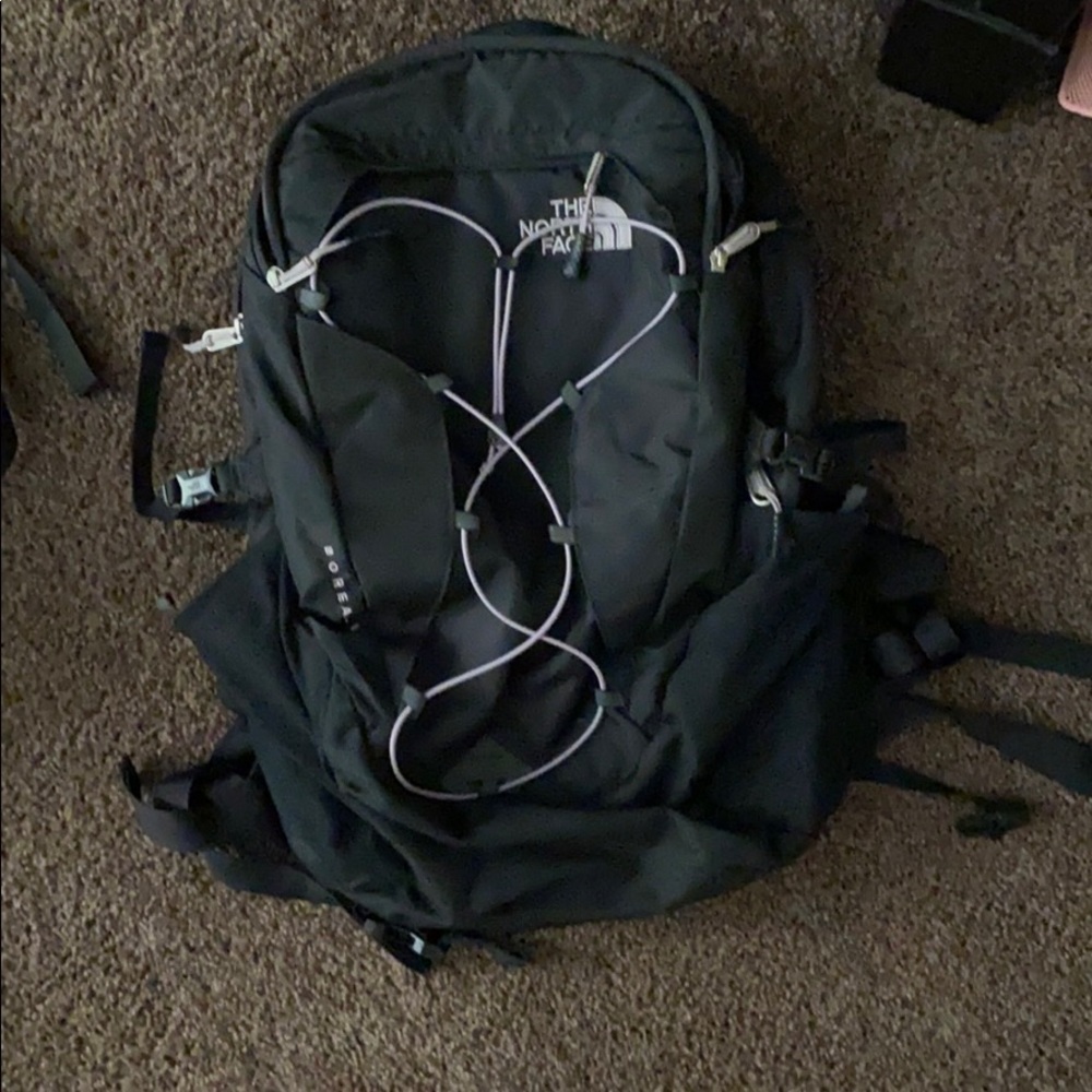 Pinkish purple and black North face backpack